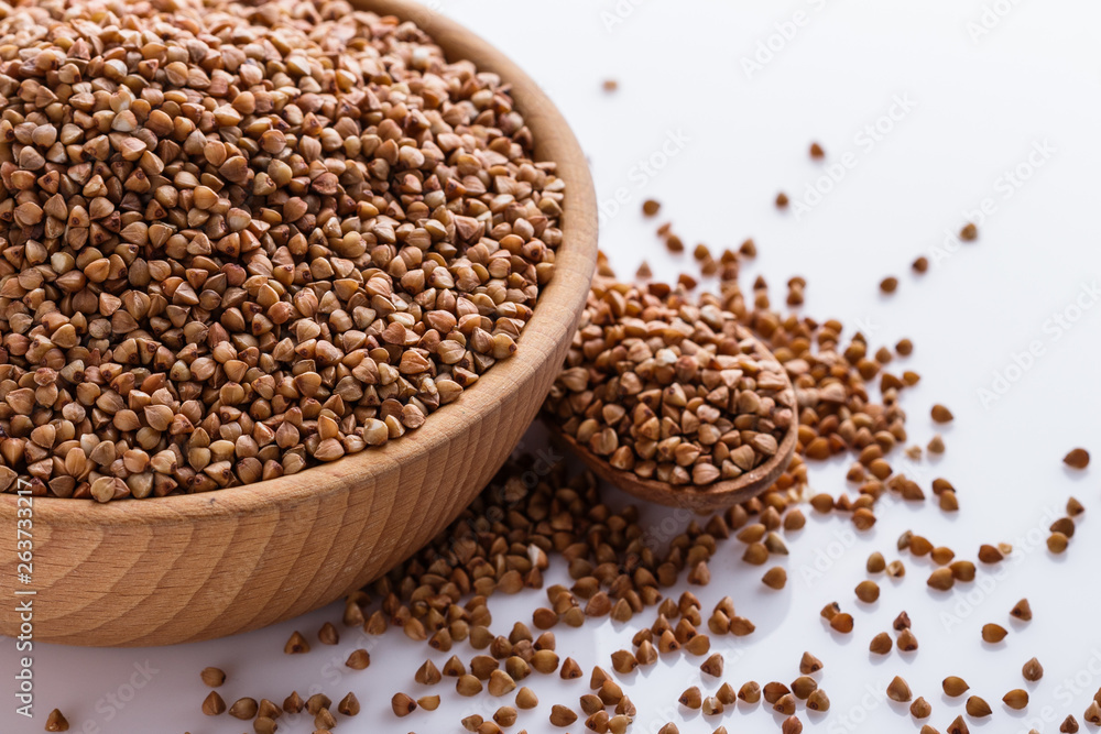 Grain buckwheat on a white acrylic background Grain buckwheat on a white acrylic background