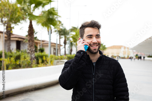 young man using mobile phone 