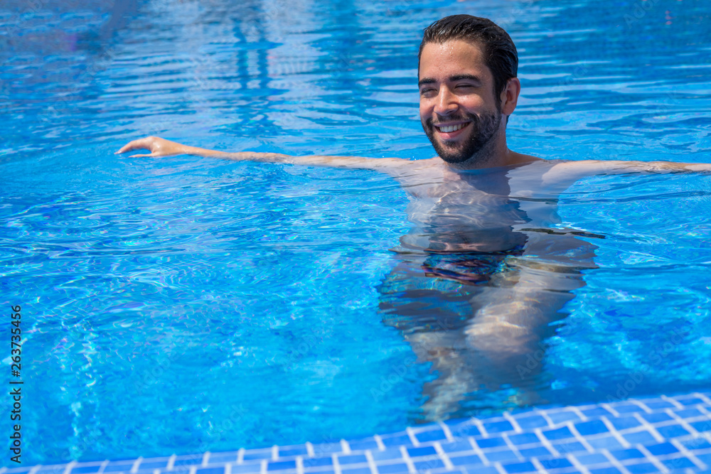 Young man relaxed in the pool