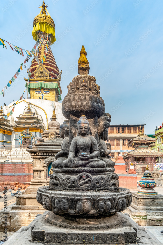 Four sitting buddhas in front of the Kaathe Swayambhu ShreeGha Chaitya stupa