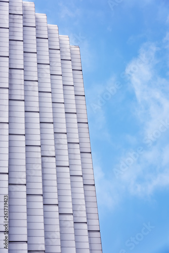 High-rise buildings in the blue sky white cloud background