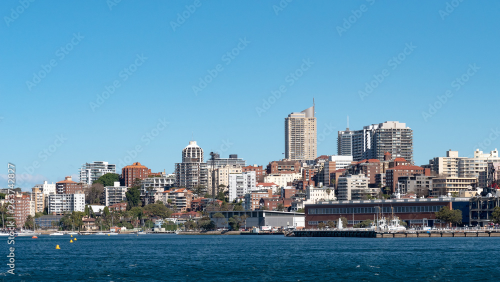 Sydney city skyline seen from the sea on a bright sunny day