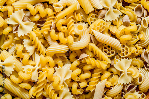 Fototapet Different types of pasta dry.