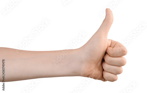 The boy's left hand shows thumb up for OK sign. Hand shows a gesture of approval. Everything is cool, everything is OK. Isolated on white. Success concept.