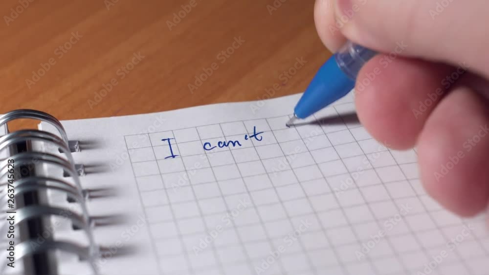 Motivation, personal growth concept. Hand is writing I CAN'T DO IT and crosses letter so that new label is I CAN DO IT Motivation, personal growth concept. Hand is writing I CAN'T DO IT and crosses letter so that new label is I CAN DO IT