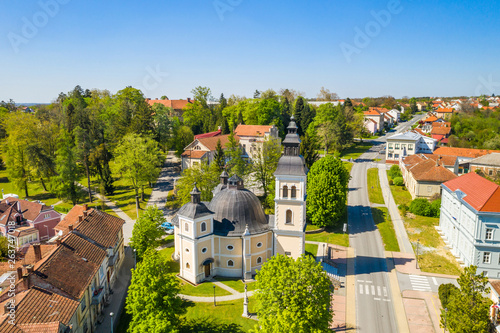 Croatia, Slavonia, town of Daruvar, main square and catholic church in spring, panoramic drone view photo