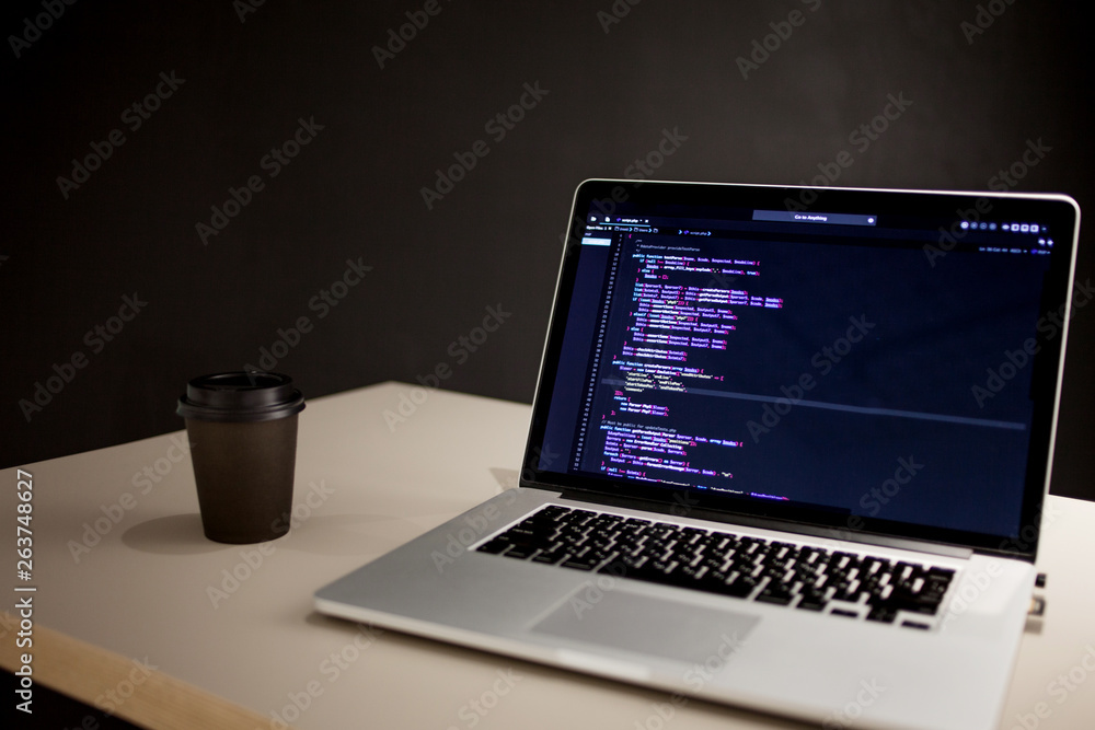 Programmer's workplace, laptop with project code. Development of websites and applications Programmer's workplace, laptop with project code. Development of websites and applications