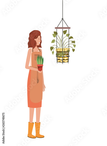 woman with houseplant on macrame hangers