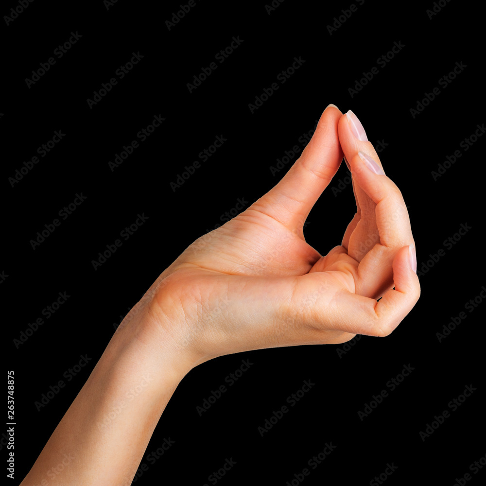 Woman hand holding something little with two fingers Woman hand holding something little with two fingers