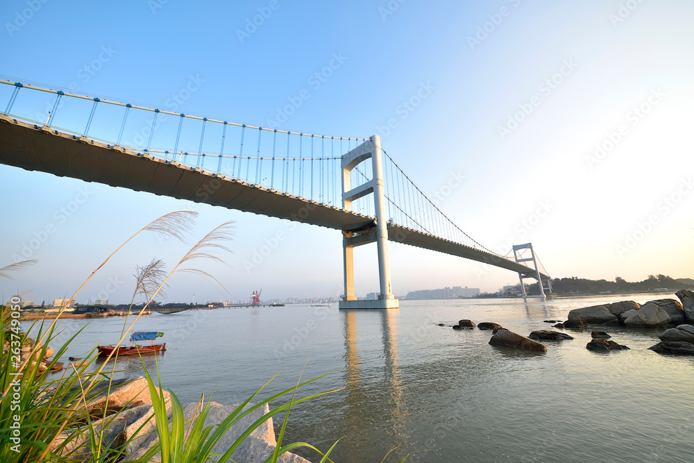 Fototapeta premium Urban traffic bridge on the water