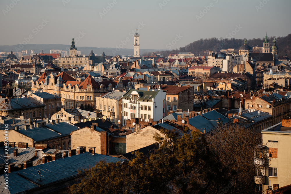 Rooftops of the old city Lviv in Ukraine during the sunset. Beautiful scenic landmark top view of the old town.