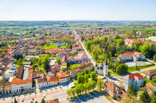 Croatia, Slavonia, town of Daruvar, main square and catholic church in spring, panoramic drone view