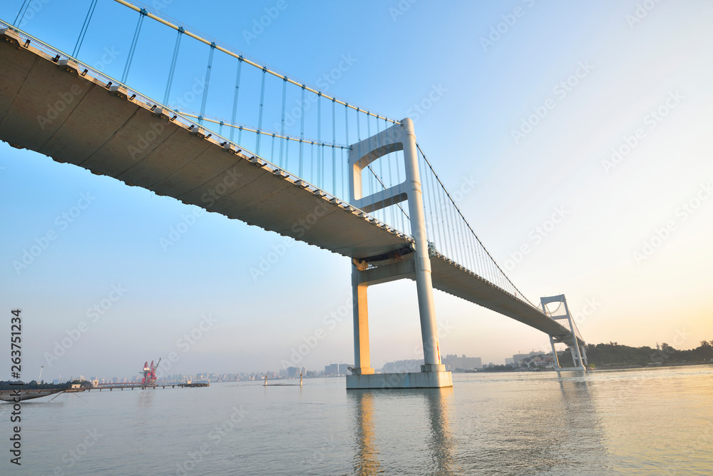 Fototapeta premium Urban traffic bridge on the water