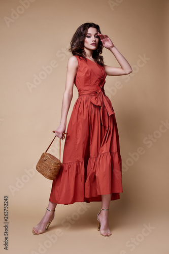 Pretty beautiful sexy elegance woman skin tan body fashion model glamor pose wear trend dress casual clothes party summer collection makeup hair style brunette success accessory jewelry studio.