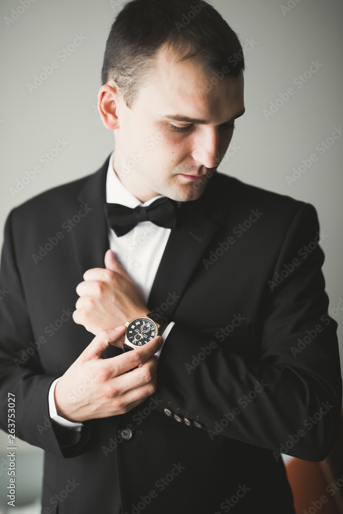 Portrait of happy businessman standing in studio Portrait of happy businessman standing in studio