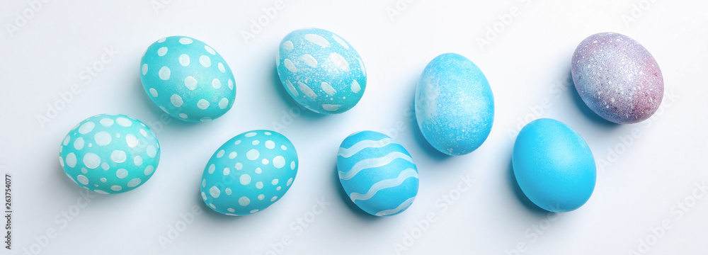 Flat lay composition with Easter eggs on white background, space for text Flat lay composition with Easter eggs on white background, space for text