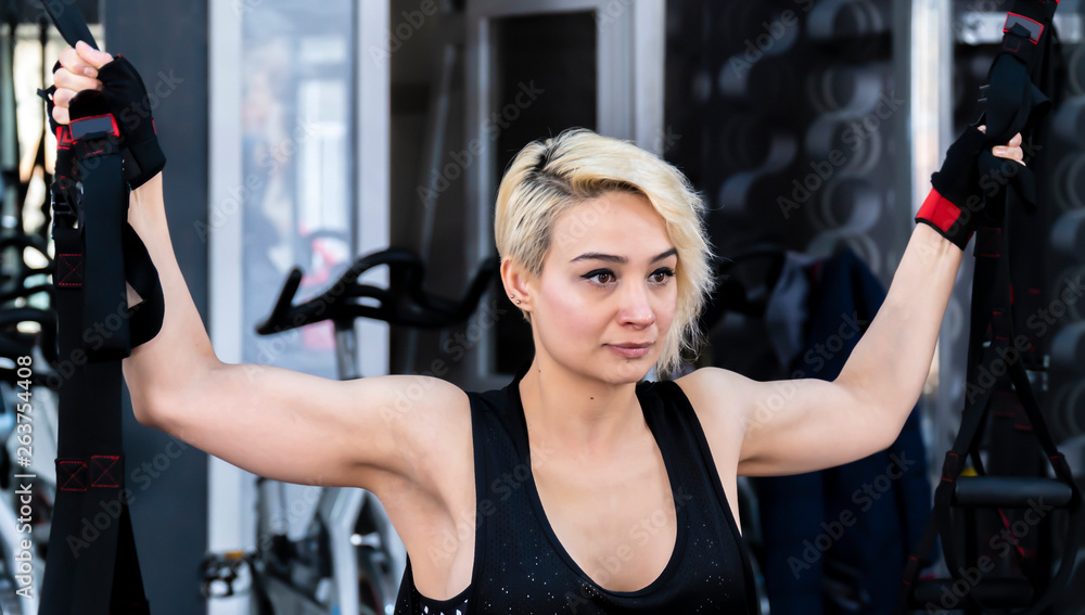 Beautiful blonde girl working at the gym center Beautiful blonde girl working at the gym center