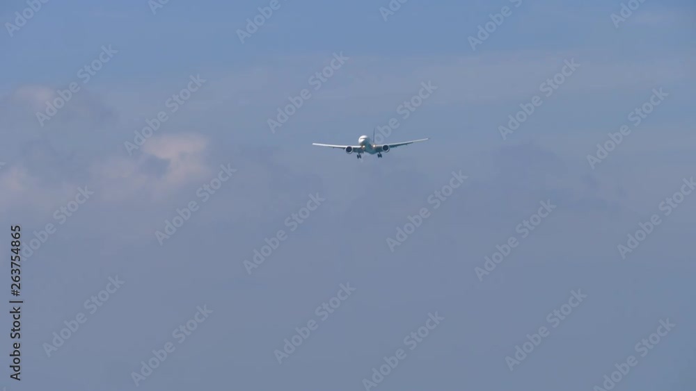 Jet airplane approaching over ocean Jet airplane approaching over ocean
