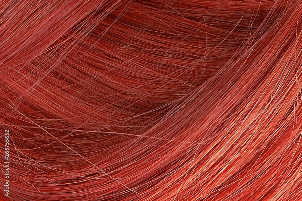 Fototapeta premium Red hair as background, texture. One of the popular shades of hair coloring