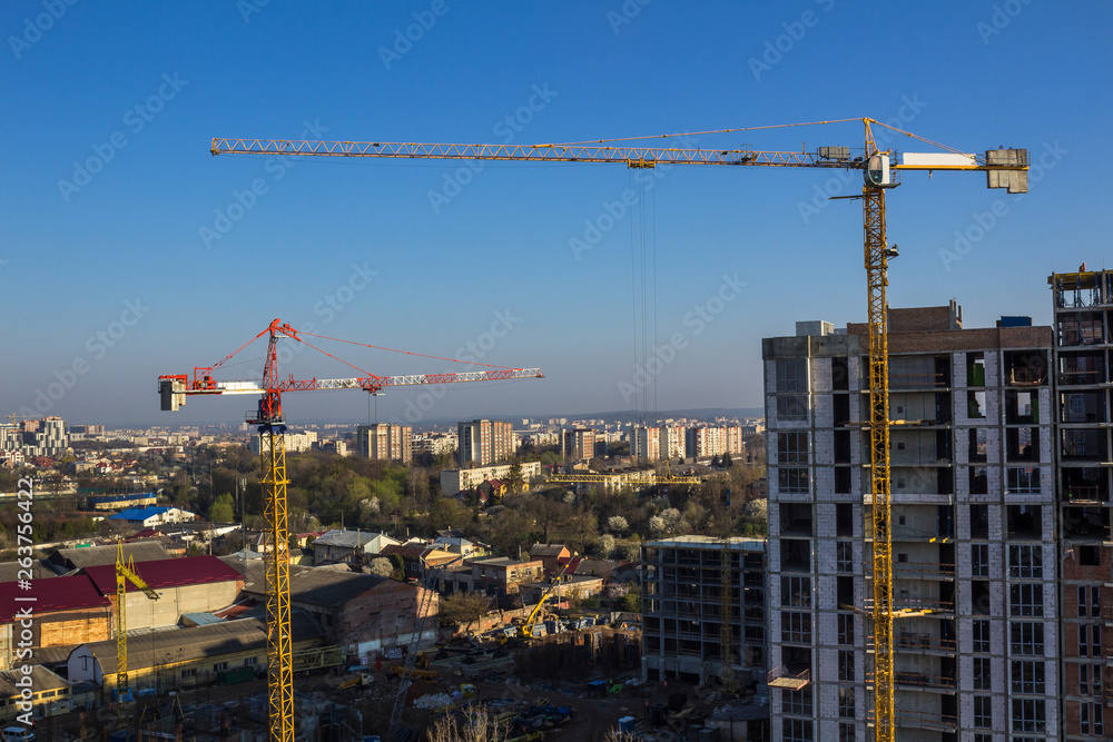 Fototapeta premium Crane and high-rise building
