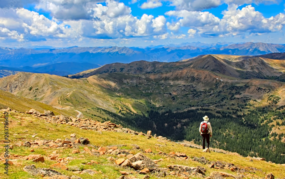 Hiker on the summit of Colorado's 13,000-foot Mount Sniktau Hiker on the summit of Colorado's 13,000-foot Mount Sniktau