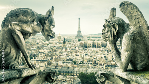 Gargoyles on Notre Dame de Paris overlooking the Paris city, France © scaliger