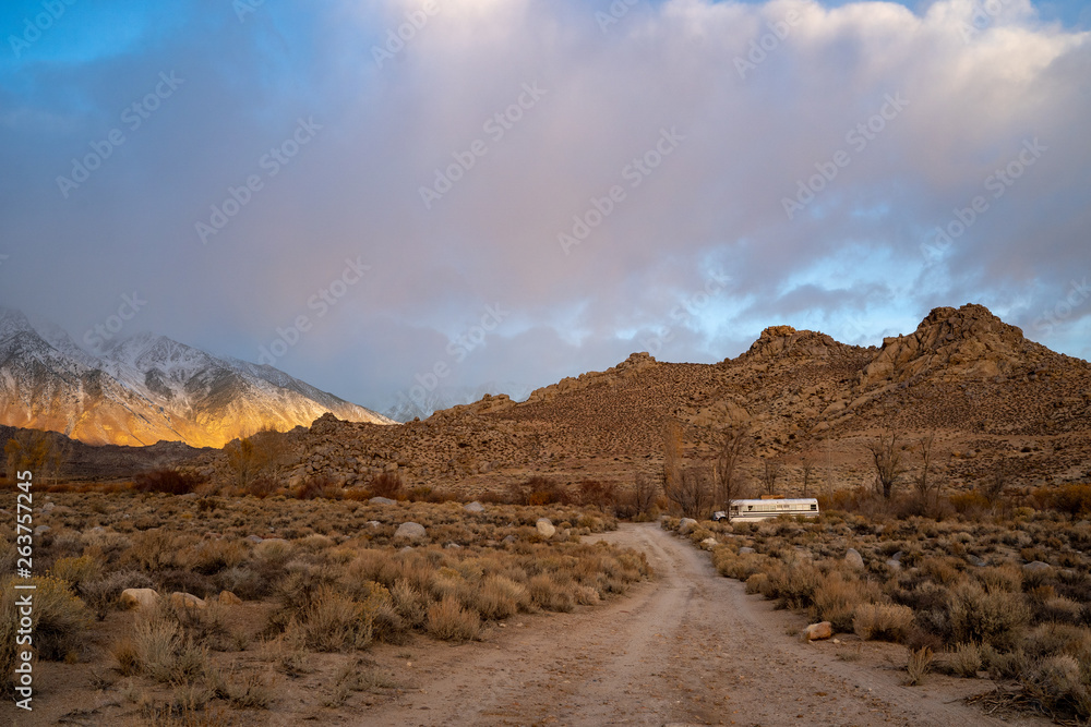 An abandoned bus on a dirt road in Bishop, California An abandoned bus on a dirt road in Bishop, California