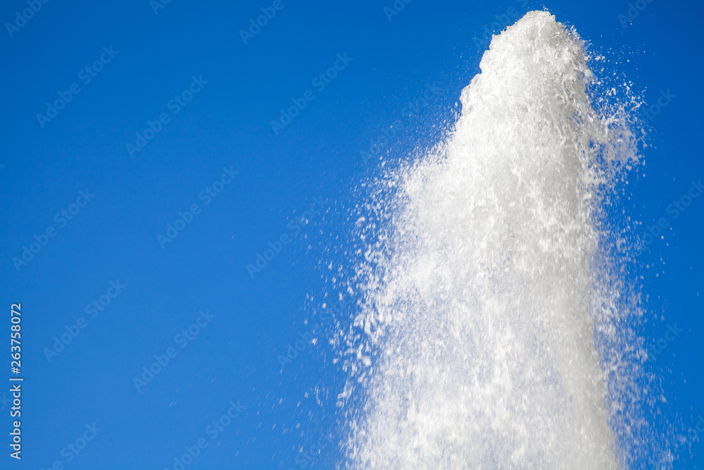 water jet against the blue sky. powerful stream of clean water