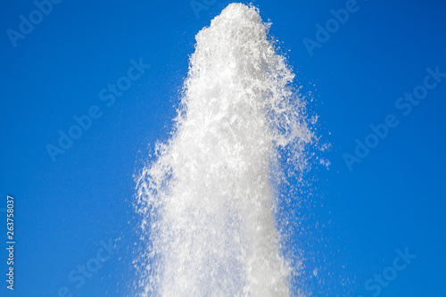 water jet against the blue sky. powerful stream of clean water