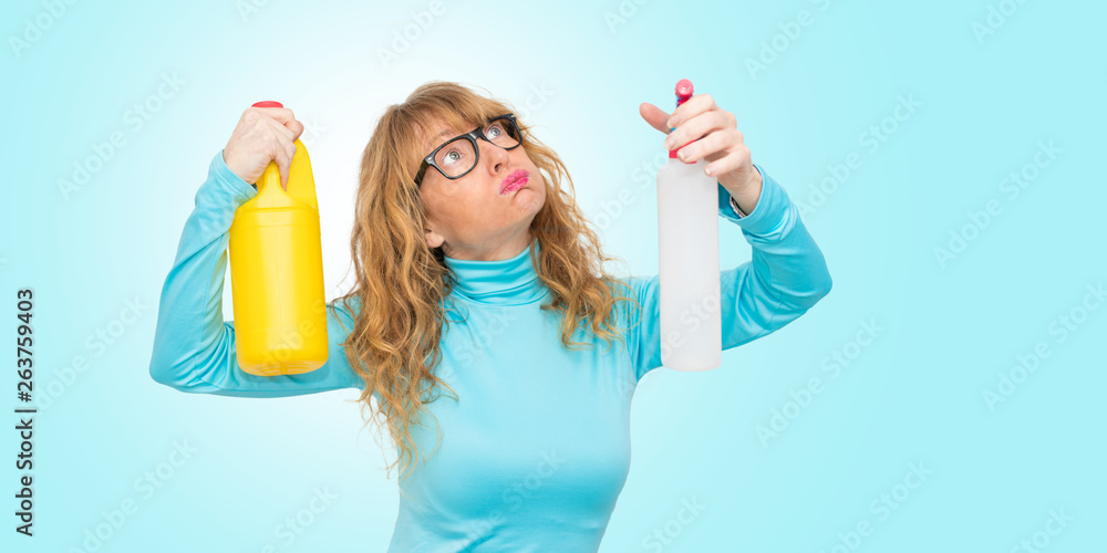 woman stressed with cleaning products woman stressed with cleaning products