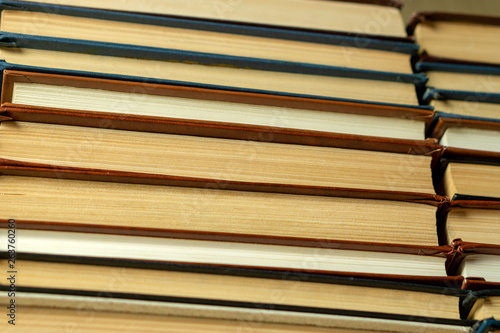 Old paper books with yellowed pages close up