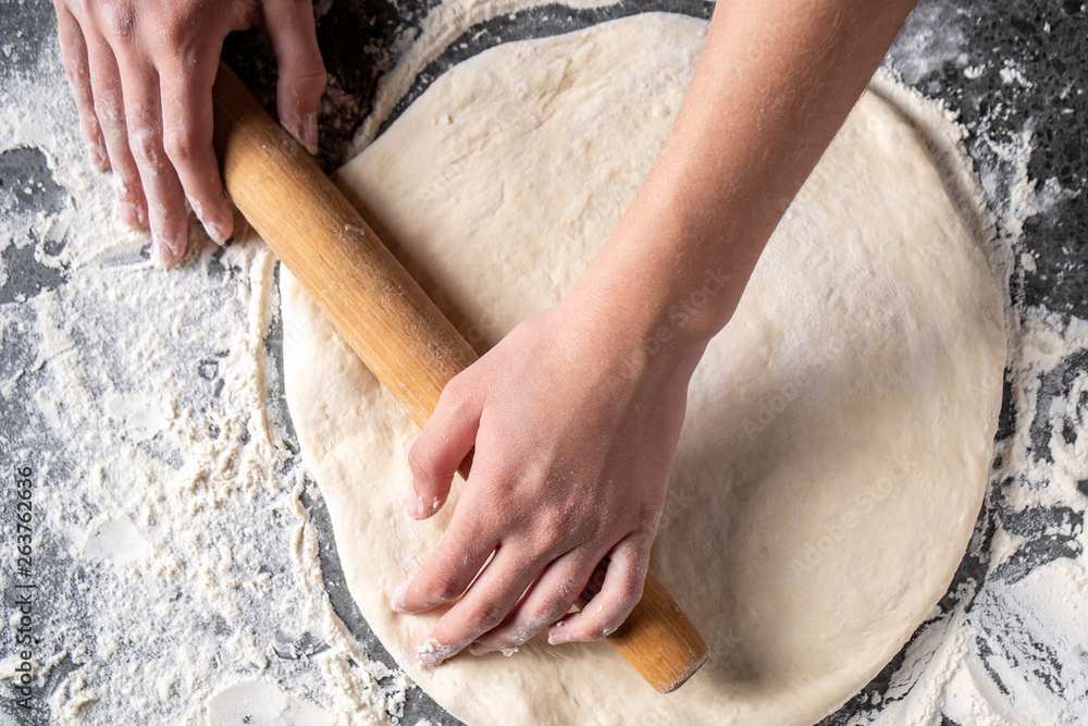 Making dough by female hands at bakery Making dough by female hands at bakery