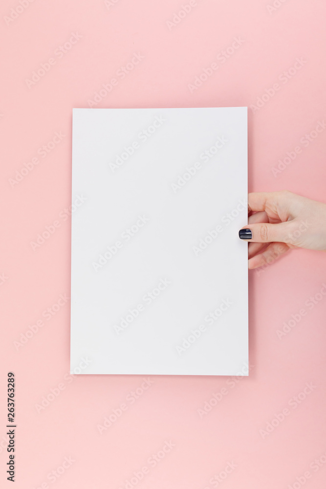 Woman hands with blank A4 paper sheet mockup Woman hands with blank A4 paper sheet mockup