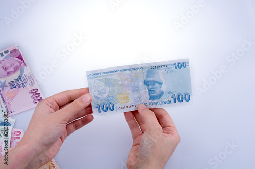 Hand holding Turksh Lira banknote  in hand photo