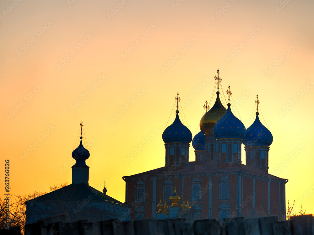 Domes of Dormition Cathedral at Ryazan during stunning sunset background