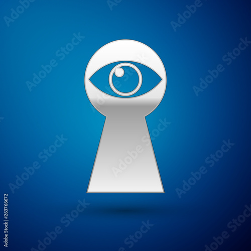 Silver Keyhole with eye icon isolated on blue background. The eye looks into the keyhole. Keyhole eye hole. Vector Illustration