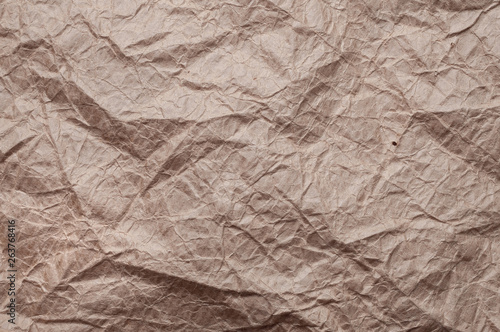 Crumpled kraft paper. Texture crumpled recycled old brown paper.
