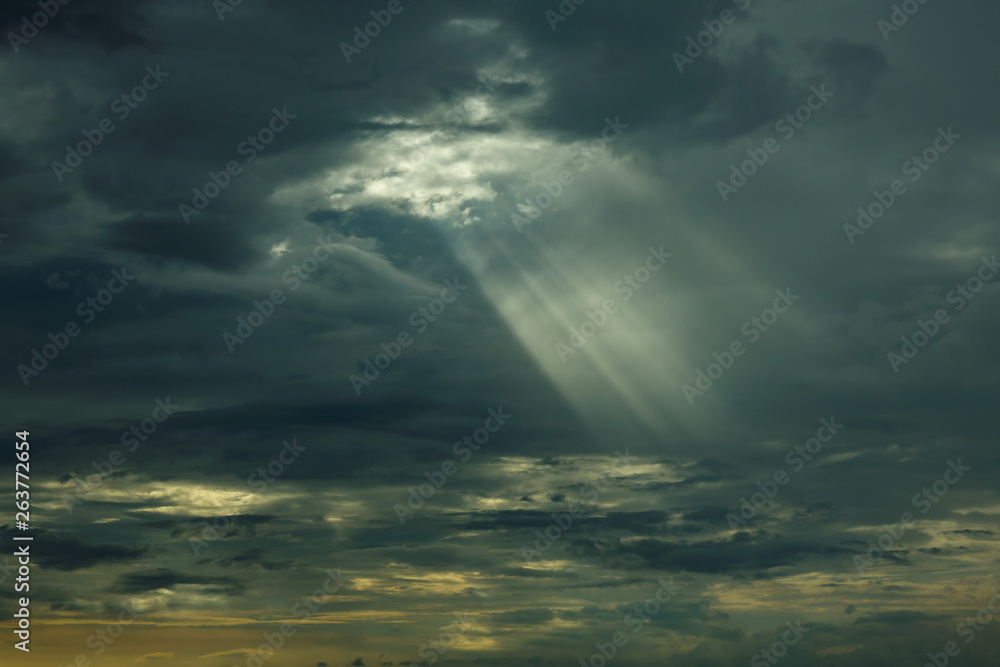 The sun's rays at sunset making their way through the clouds. The sun's rays at sunset making their way through the clouds.