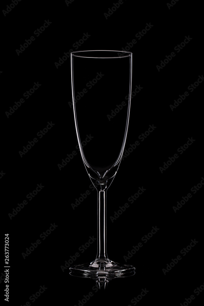 Champagne glass on black.