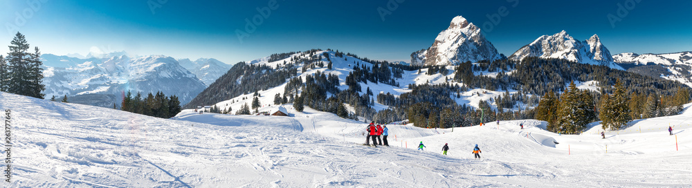 People skiing in Mythenregion ski resort, Ibergeregg, Switzerland, Europe.