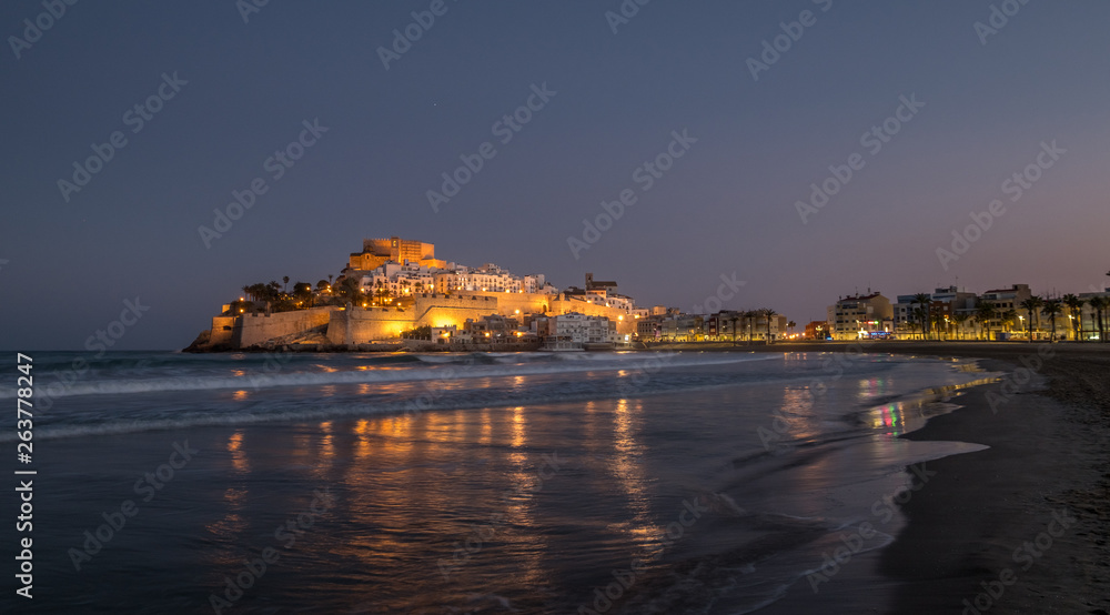 Peniscola skyline and castle beach night illuminated in Castellon of Spain