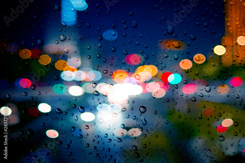  Rainy day. Raindrops on a blurred multicolored bokeh background