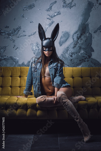 Fashion model wearing black rabbit mask