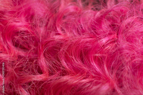 Pink hair, close-up stylish afro spiral curly hairstyle © Kate