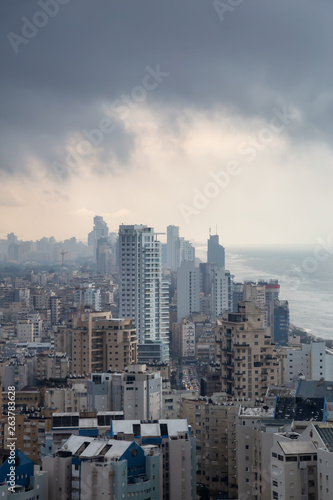 Aerial view of a residential neighborhood in a city during a cloudy sunrise. Taken in Netanya  Center District  Israel.