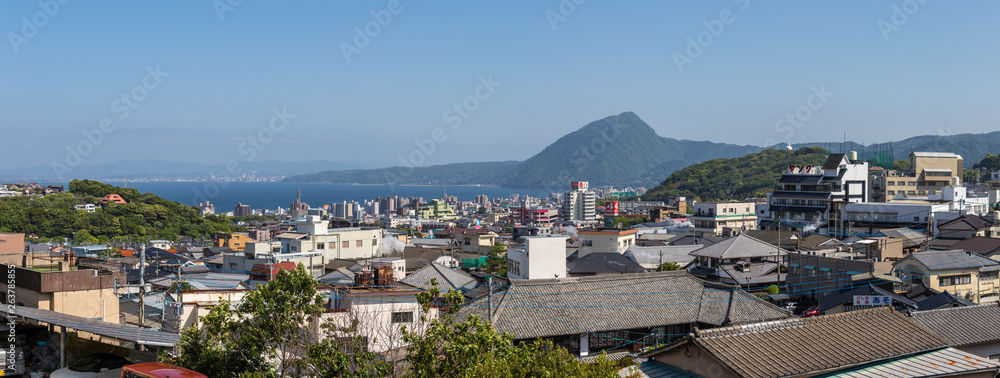 Panoramic view on Skyline of Beppu City and Bay. Town Oita in the Background. Beppu, Oita, Japan, Asia.