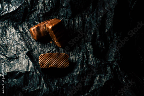chocolate candies on black ...