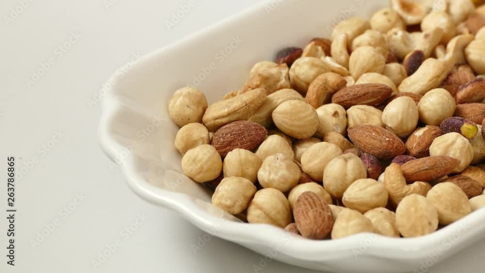 nuts, cashew nuts, dry almonds all on a plate close up nuts, cashew nuts, dry almonds all on a plate close up