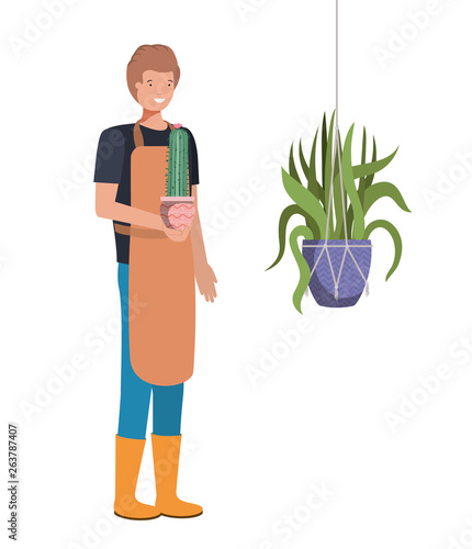 man with cactus in macrame hangers