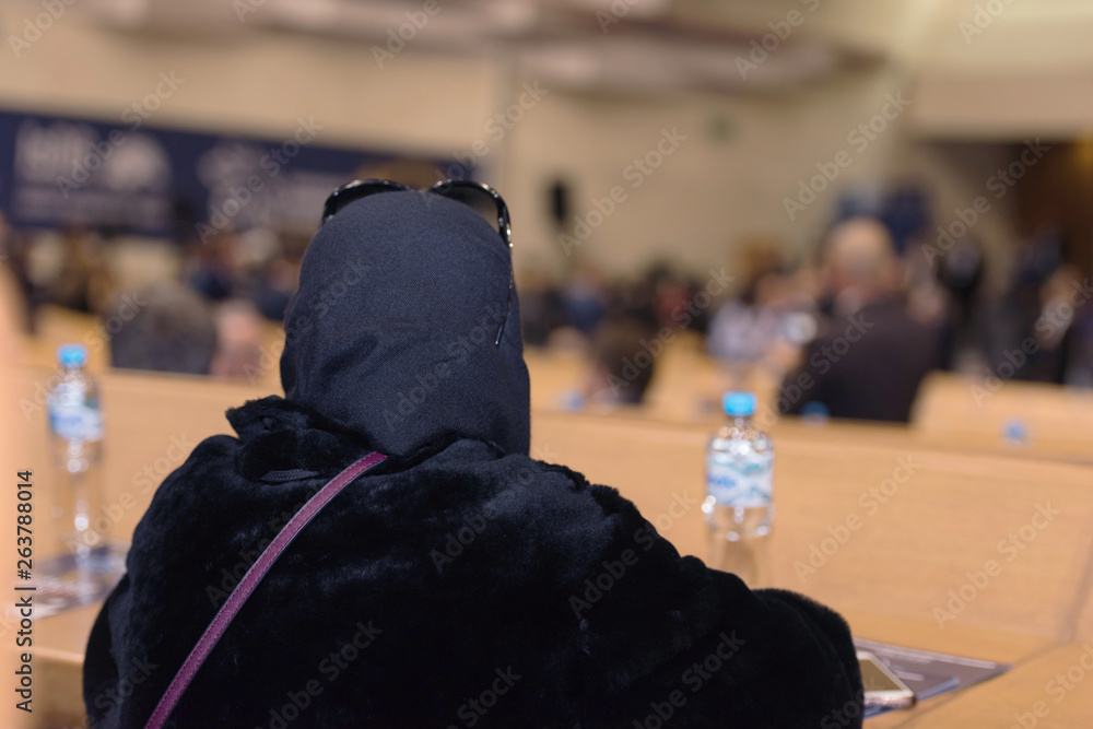 Muslim Business woman at business conference room with public giving presentations. Audience at the conference hall. Entrepreneurship club. Muslim Business woman at business conference room with public giving presentations. Audience at the conference hall. Entrepreneurship club.